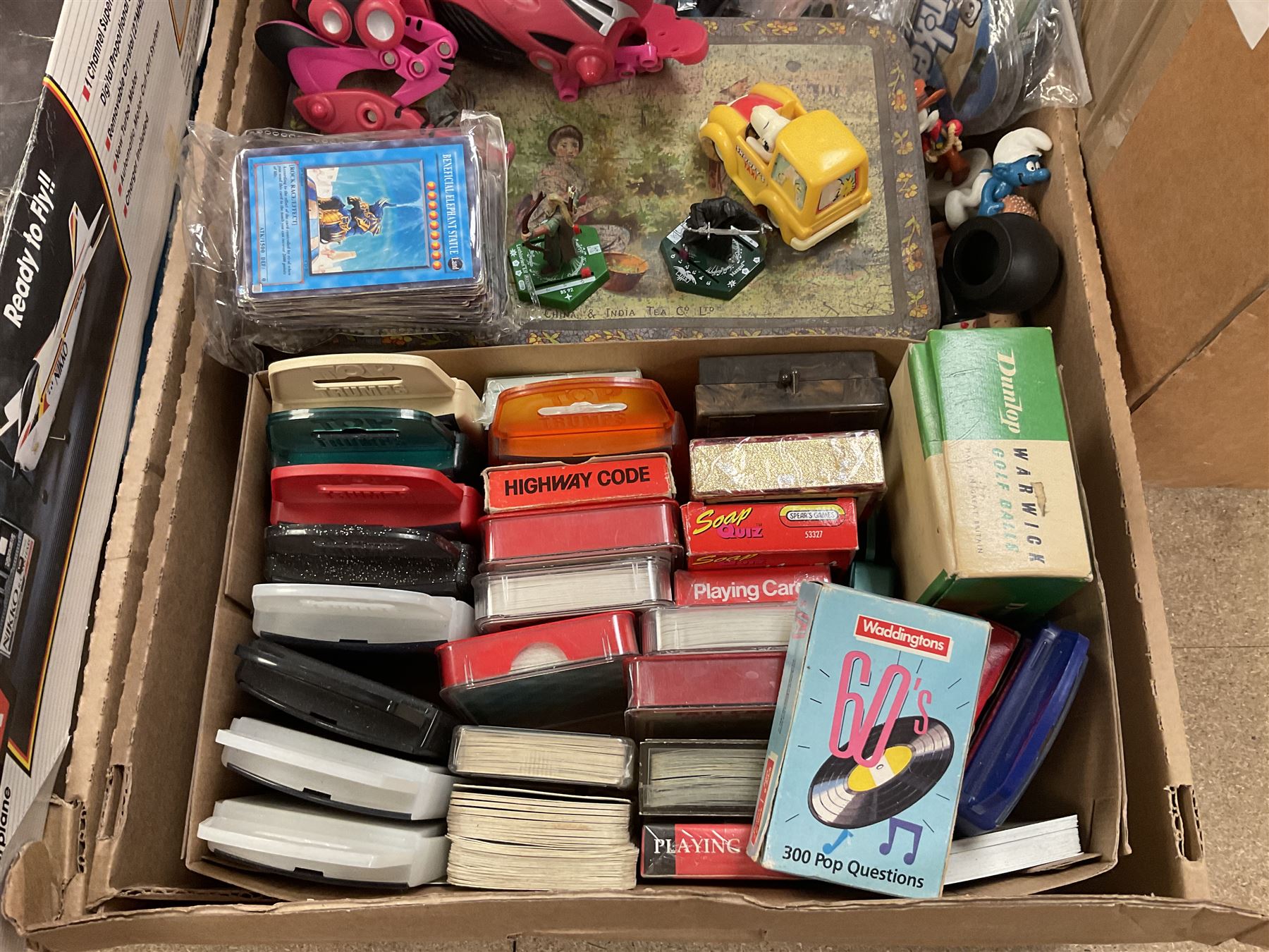 Large quantity of modern toys to include Matchbox Chopper Chase, Nikko battery control airplane, small amounts of K’nex, Meccano, playing cards to include Yu-Gi-Oh cards, keyrings etc in three boxes 