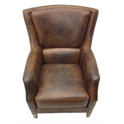 Library chair, upholstered in tan leather, studded detail, light wood square feet
