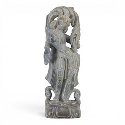 Stone carving of goddess, together with material with gold thread decorated with stylised flowers 