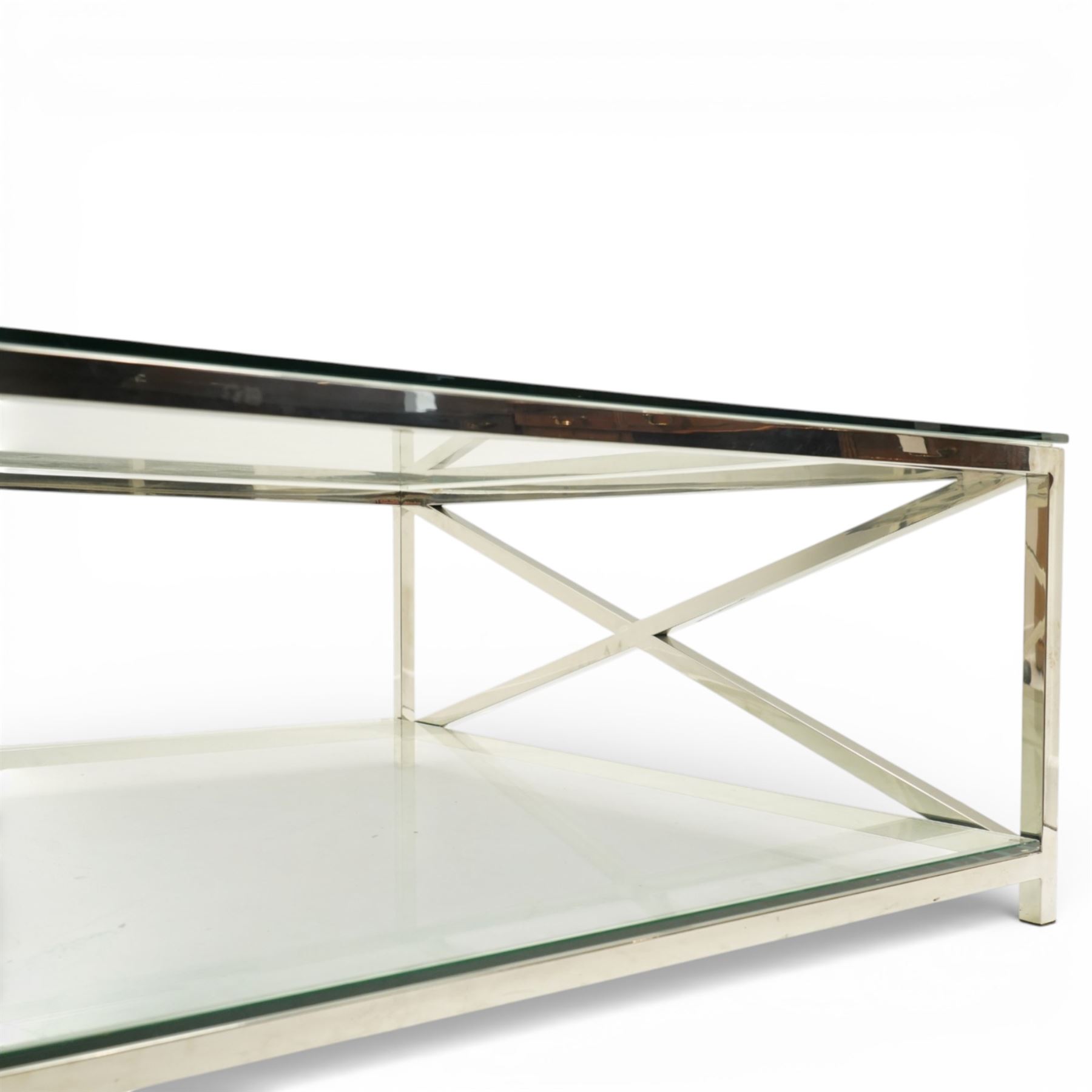 Modern chrome and glass coffee table, square plate glass top on polished chrome frame, the sides formed with X-frame stretchers, raised on square supports with lower glass tier