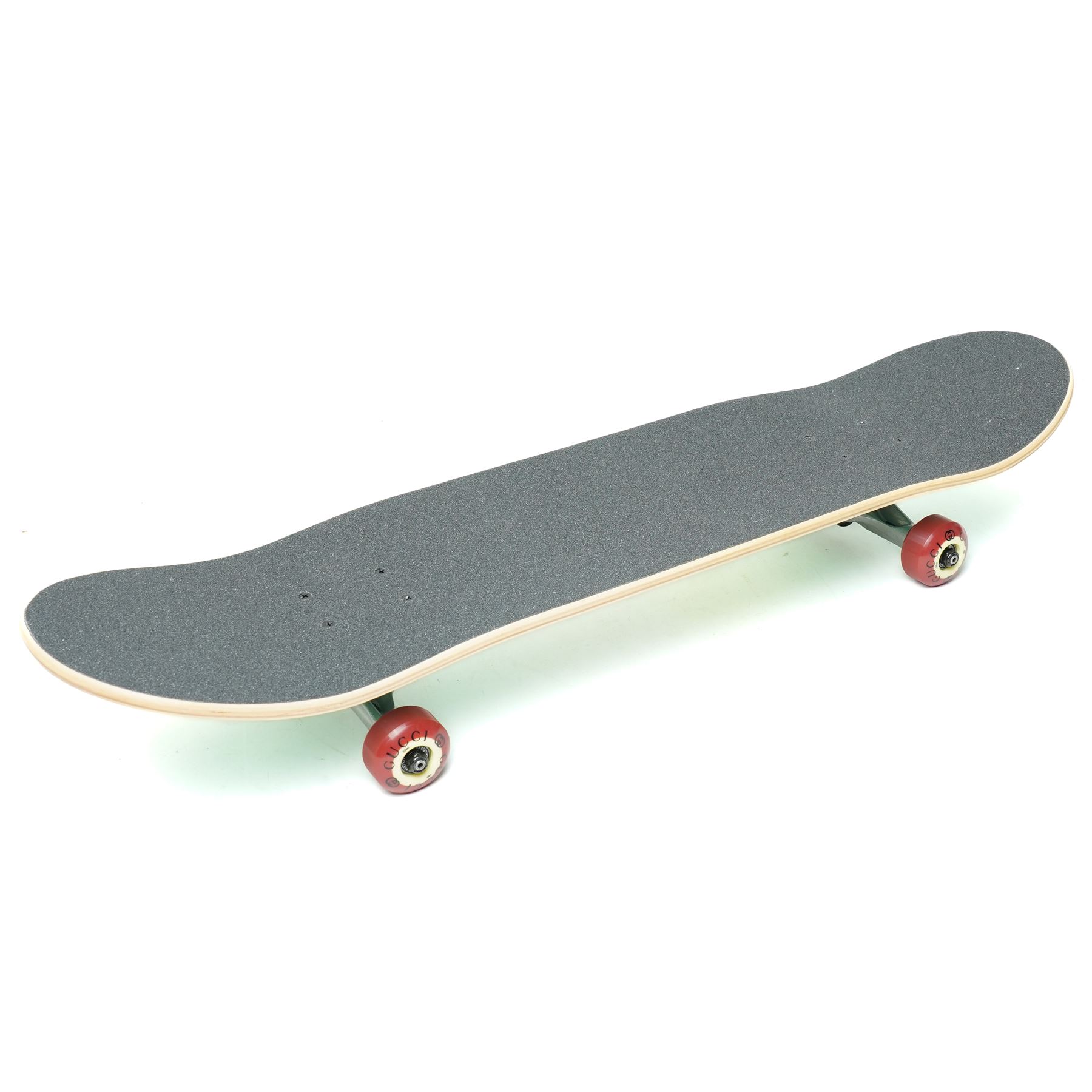 Gucci x Palace skateboard, Spring/Summer 2021, green GG monogram wood deck with multicolour ‘AH AH AH! GUCCI’ lettering and cartoon character mascot motif, fitted with Gucci-branded metal trucks and red and cream wheels, model no. 689103 JCGMN, presented with original GG monogram drawstring dust bag, protective sleeve, outer box and accompanying cards, Skateboard L81cm W20cm