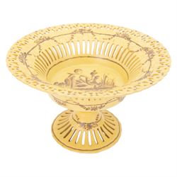 Continental tazza, decorated with swag, the central panel with cerub, marked Toussi Court beneath, H20cm