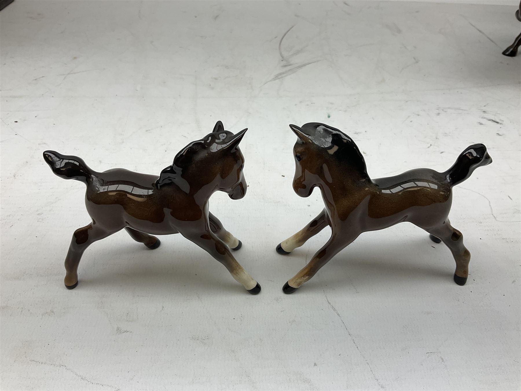 Six Beswick figures of bay horses, including large hunter no.1734, Shire horse no.818, horse with tucked head no.1549, etc (6)