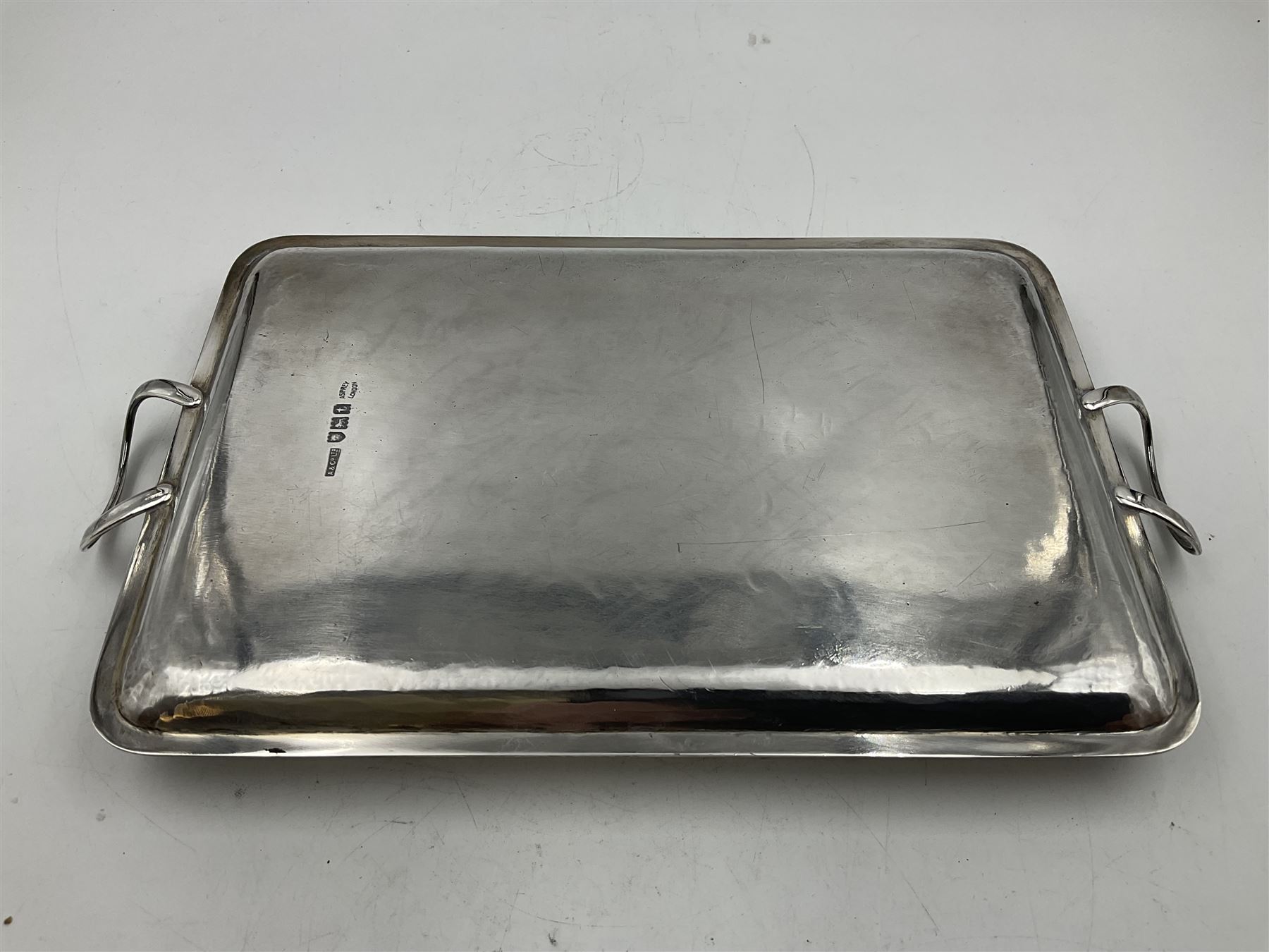 Small early 20th century silver tray, of rectangular form with reeded edge and twin reeded handles, hallmarked Asprey & Co Ltd, London 1914, including handles W26.5cm