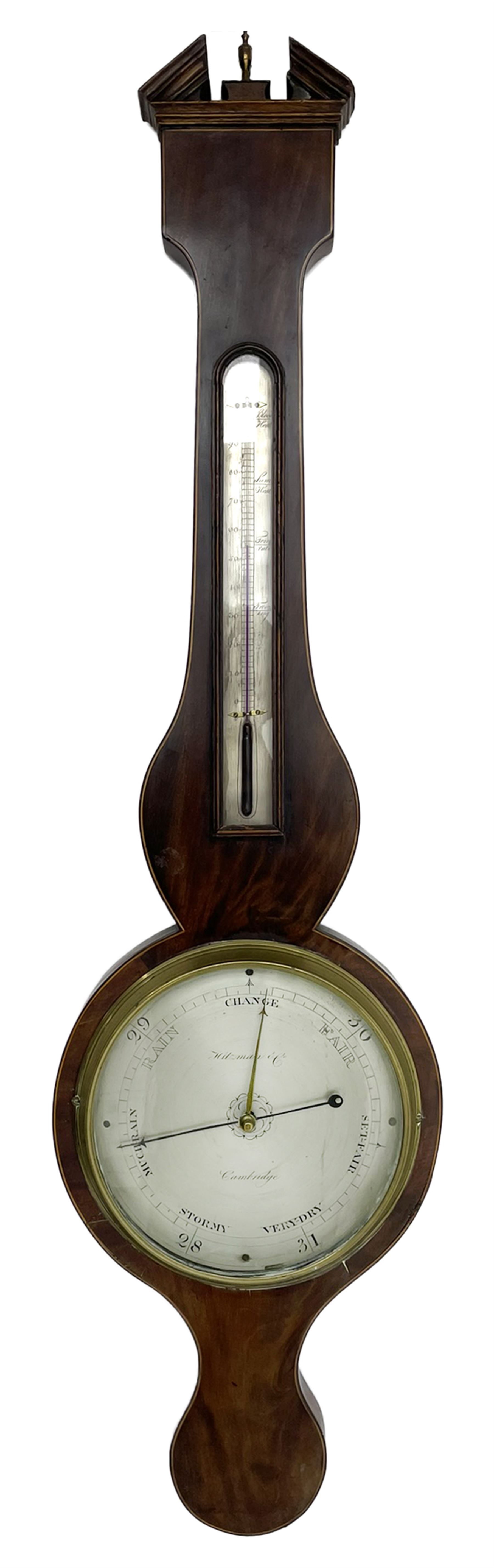 Hitzman & Co of Cambridge - Early 19th century mahogany mercury wheel barometer c1830,
With a broken pediment and finial, rounded base, and lined stringing to the edge, cast brass bezel with an 8-inch circular silvered register calibrated in inches and signed Hitzman & Co, Cambridge, with brass setting pointer to the glass, beneath an arched 12” Fahrenheit scale spirit thermometer with a silvered register. Joseph and Henry Heitzman were German barometer makers and clock importers who lived and worked in Trinity Street Cambridge 1820-1900, often found as here spelt Hitzman.
