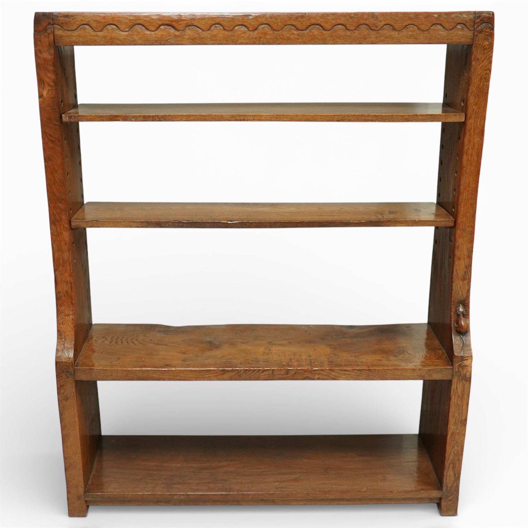 Mouseman - circa 1920s/1930s oak open back 3ft bookcase, the adzed top with scalloped detail, dual depth adzed ends, with two adjustable shelves over two fixed shelves, with carved fat mouse signature, by Robert Thompson of Kilburn