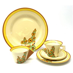 A Clarice Cliff Bizarre by Wilkinson Limited dinner plate, trio and cup in the Sunshine pattern. (5).