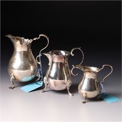Georgian design silver cream jug with crimped rim and engraved with a crest London 1901 Ma...