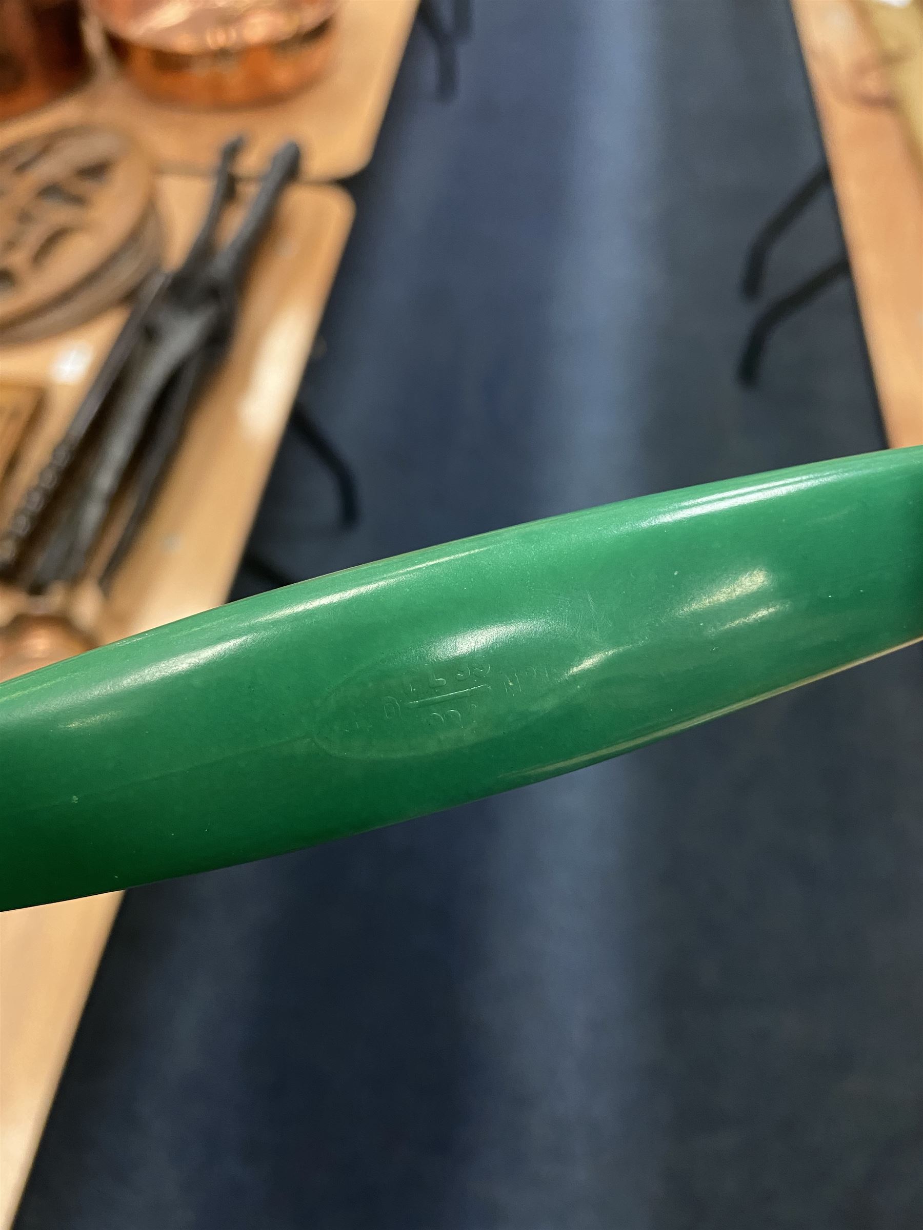 Jade green Bakelite telephone, of pyramid form with alphabet dial, brown braided handset cord and a base draw