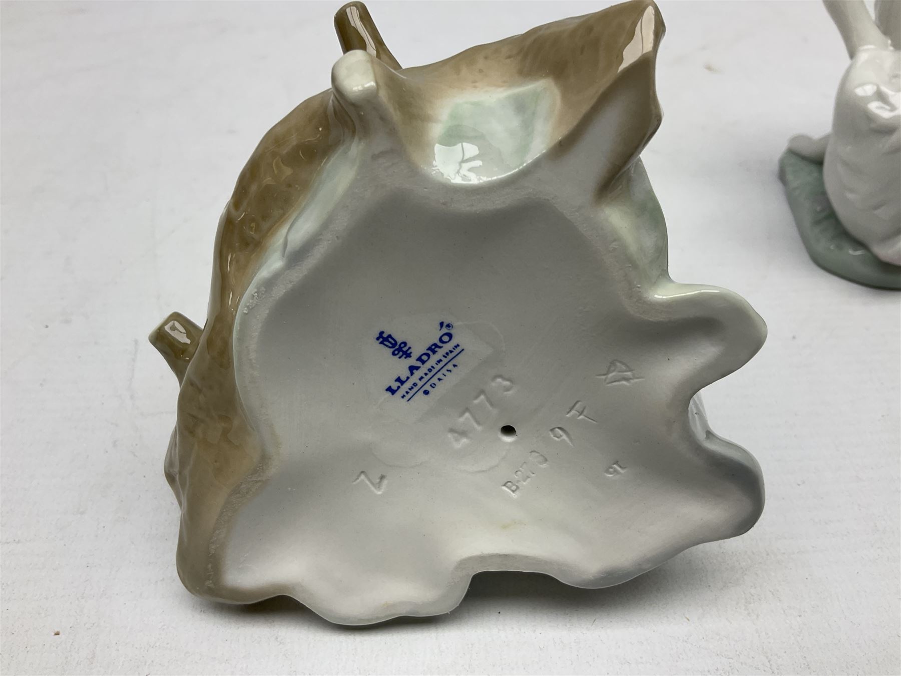 Six Lladro figures, comprising A Friend for Life no 7685, Rabbit Eating no 4773, Sitting Bunny no 5907, Washing up no 5887, Surprised cat no 5114 and Scar-dy Cat no 5092, all with original boxes, largest example H15cm 