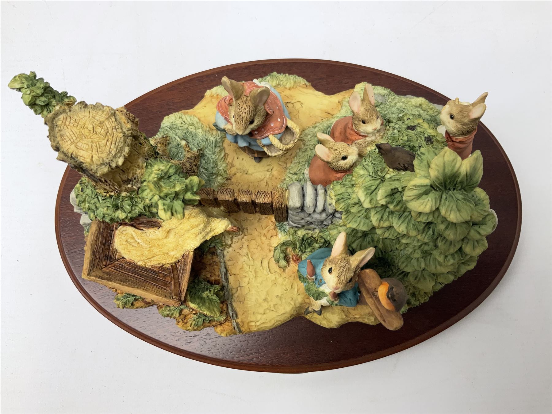 Four Border Fine Arts Beatrix Potter figures, comprising Tableau created to commemorate the Millenium together with a Border Fine Arts Limited Edition no 669814, The Tale of Peter Rabbit Tablet A1306, Four Little Rabbits A2442 and Sailing Home A2443