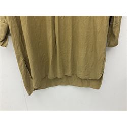 1930s Hitler Youth brown shirt, long length with two pockets, bears triangular badge 'Nord Nordsee'