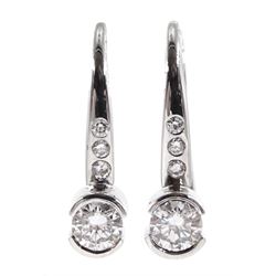 Pair of 18ct white gold diamond pendant half bezel set earrings, hallmarked, total diamond weight approx 0.26 carat
