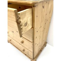 Solid pine chest, two short and three long drawers, turned supports 
