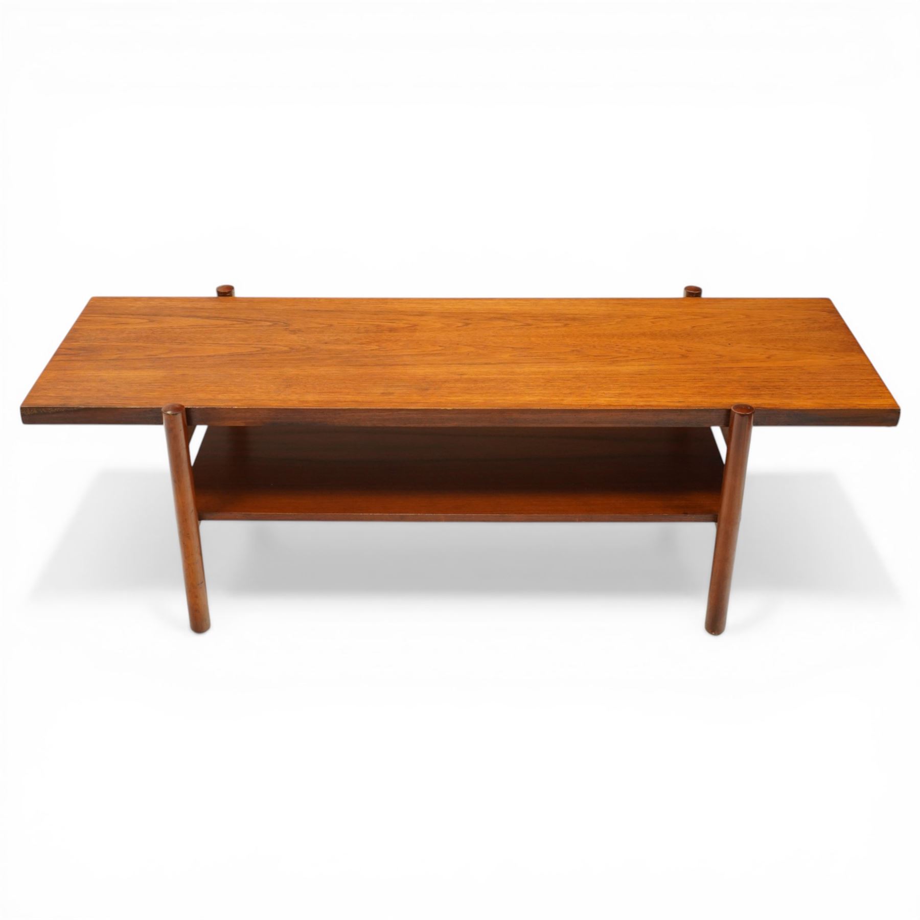 Mid-20th century Danish teak coffee table, rectangular top raised on cylindrical supports, united by under-tier 