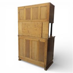 Continental Art Nouveau cocktail cabinet, the stepped cornice over a glazed upper section with panelled doors, enclosing fitted shelf, the central section with mirrored back and green baize serving surface flanked by ebonised and gilt detailed pilasters, the base fitted with cupboard doors inlaid with stylised foliate and geometric motifs, on a plinth base