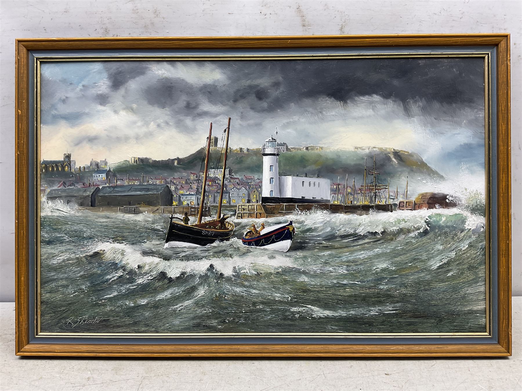 Robert Sheader (British 20th century): Scarborough Lifeboat and Fishing Boat SH87 off the Lighthouse, oil on board signed 37cm x 60cm 