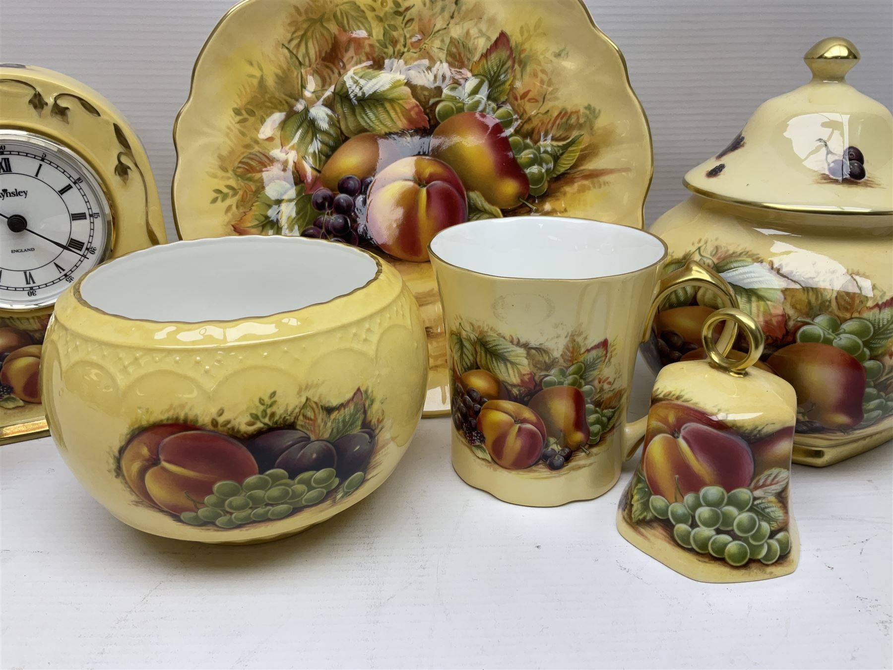 Aynsley Orchard Gold five coffee cans and saucers, mantel clock, plate etc 