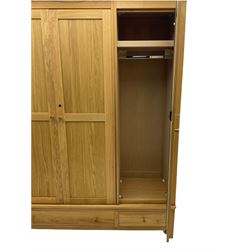 Corndell Furniture - light oak triple wardrobe, enclosed by three panelled doors, one long and one short drawer