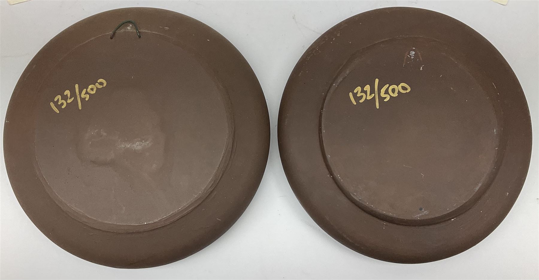 Two Terry Pratchett Discworld limited edition sculptured bas-reliefs, designed by Clarecraft, comprising Death Study created by 'the cunning artificer, Bernard the stout', 132/500 and The Hogfather, created by 'the cunning artificer, Bernard the stout', 132/500, both with certificates of authenticity.   