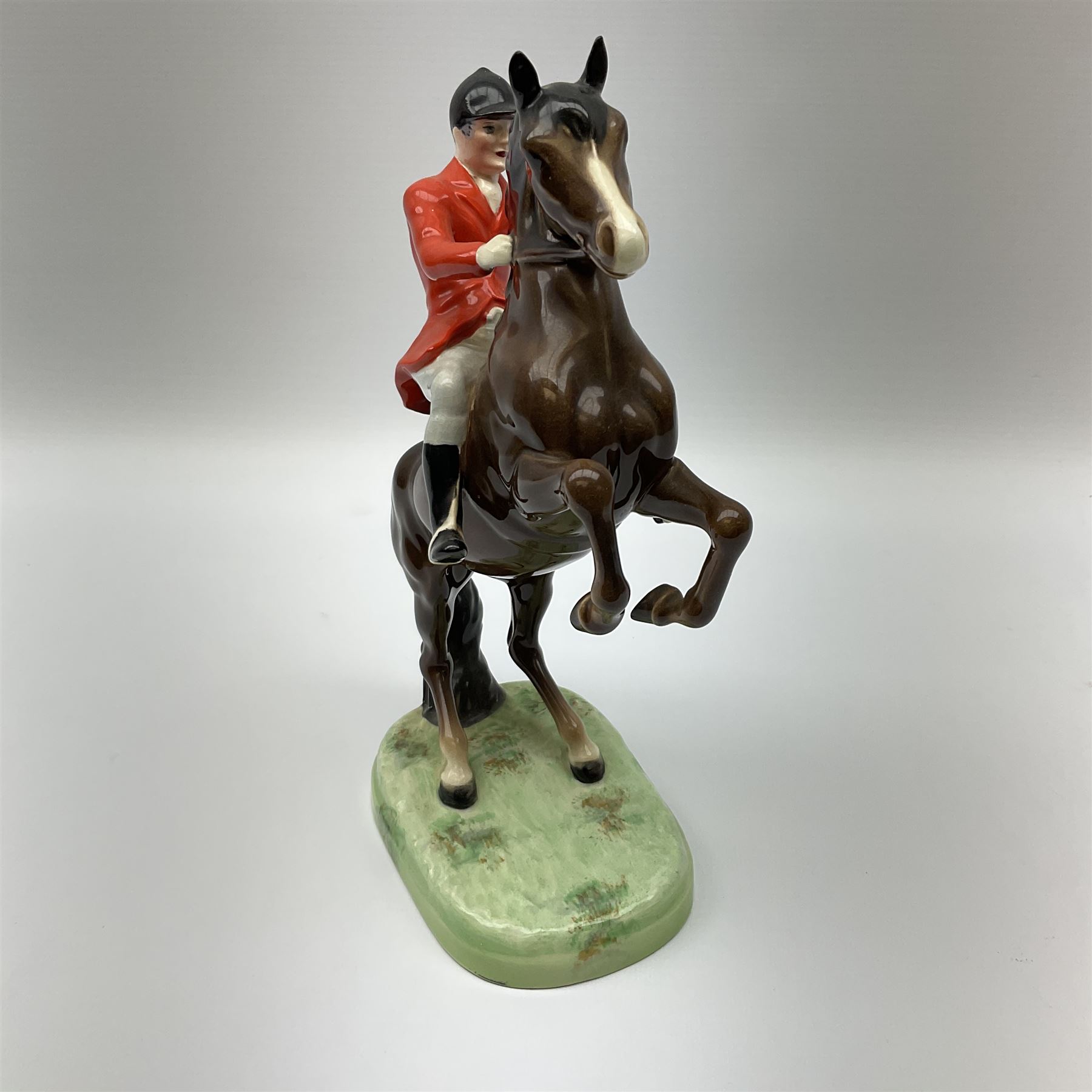 A Beswick model of a huntsman on rearing horse, model no 868 2nd edition, with printed mark beneath, H25cm. 