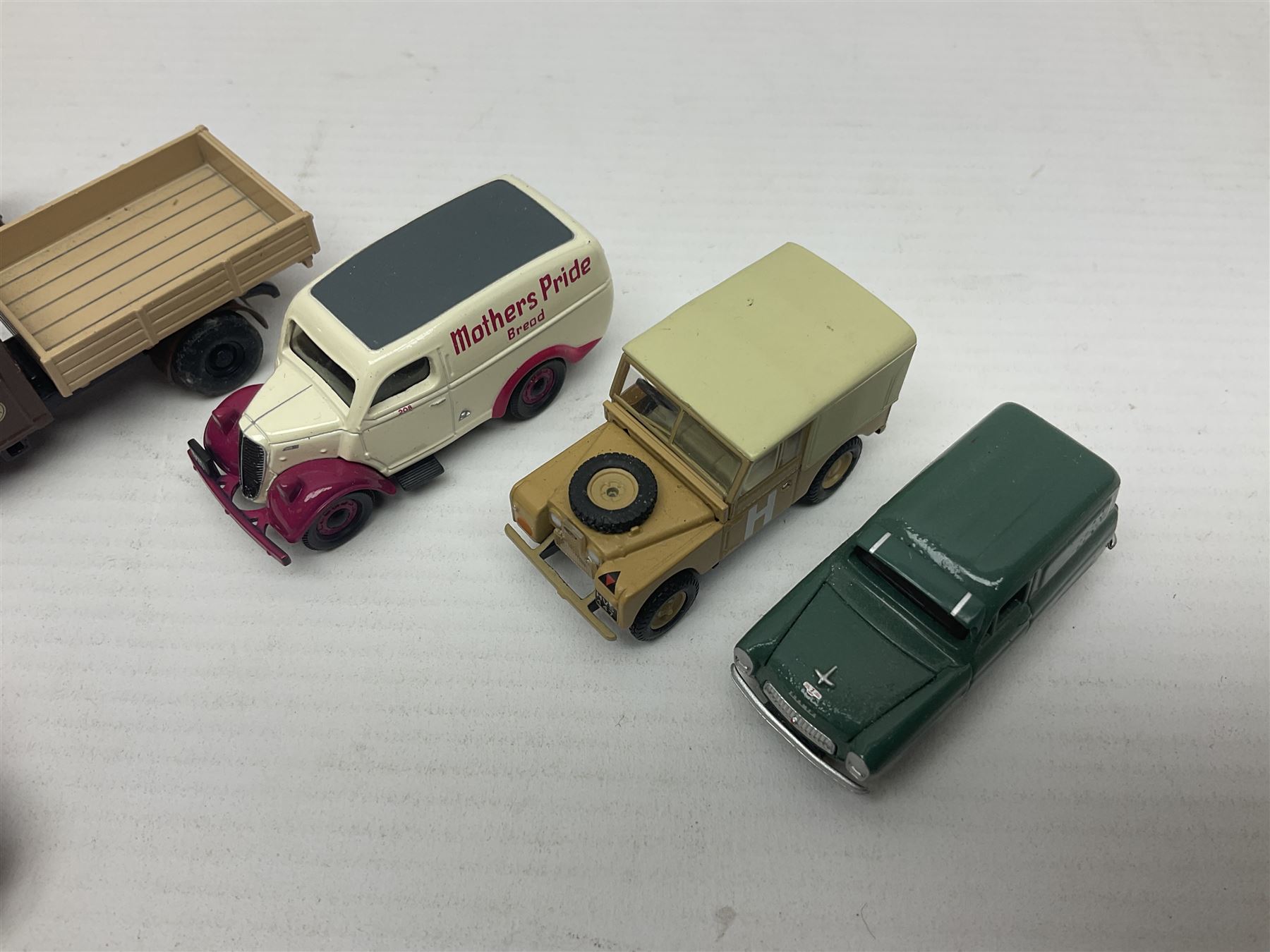 Over forty 1:76 scale die-cast models of cars and commercial vehicles; some boxed; and eight small scale models of motorcycles; all unboxed