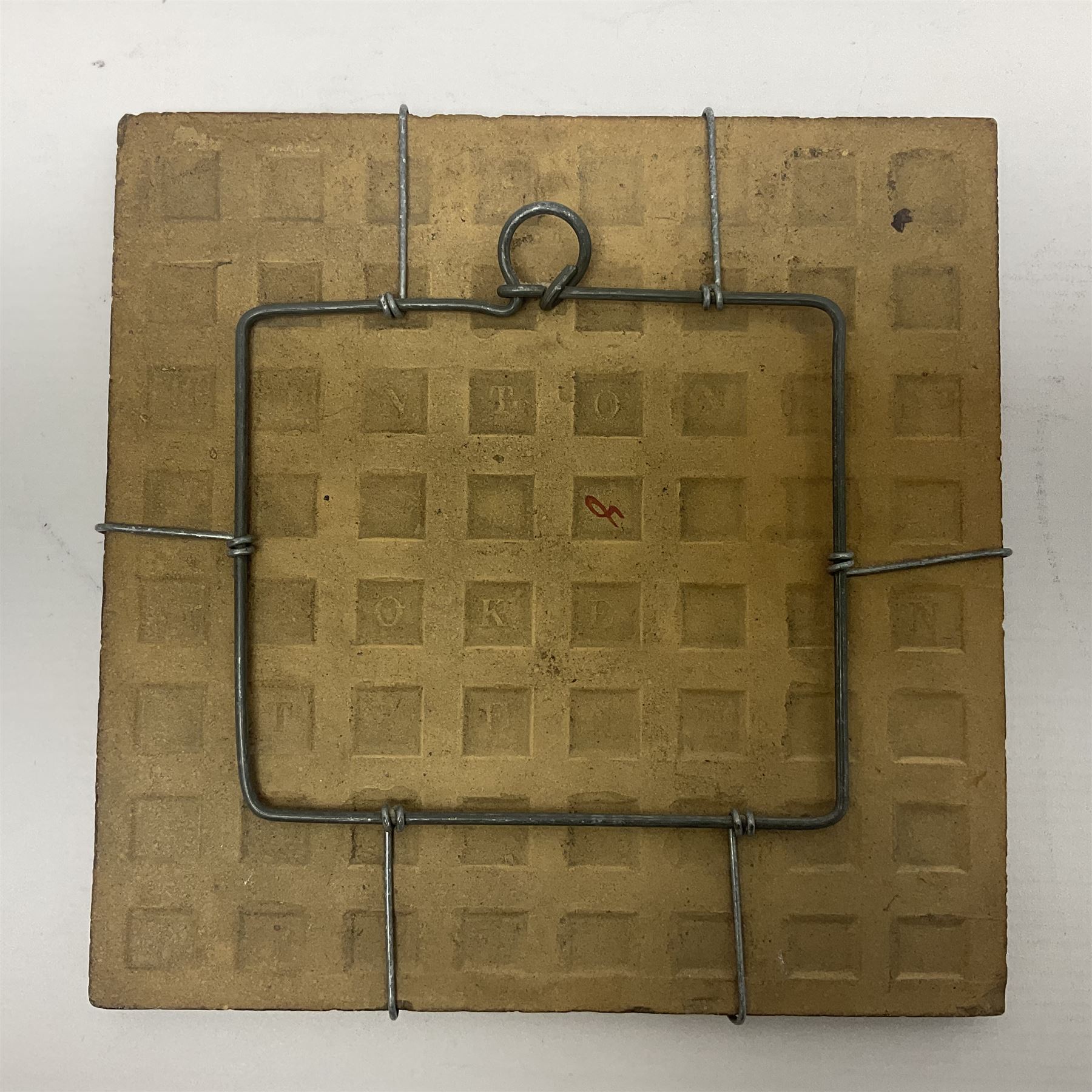 19th century Minton & Co majolica tile, decorated in relief with a bird upon a fruiting branch against a blue ground, with textured ochre border and anthemion to each corner, impressed mark verso, H19.7cm