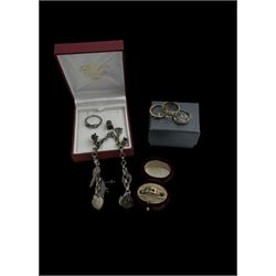 Four 9ct gold stone set rings, silver ring and a silver charm bracelet