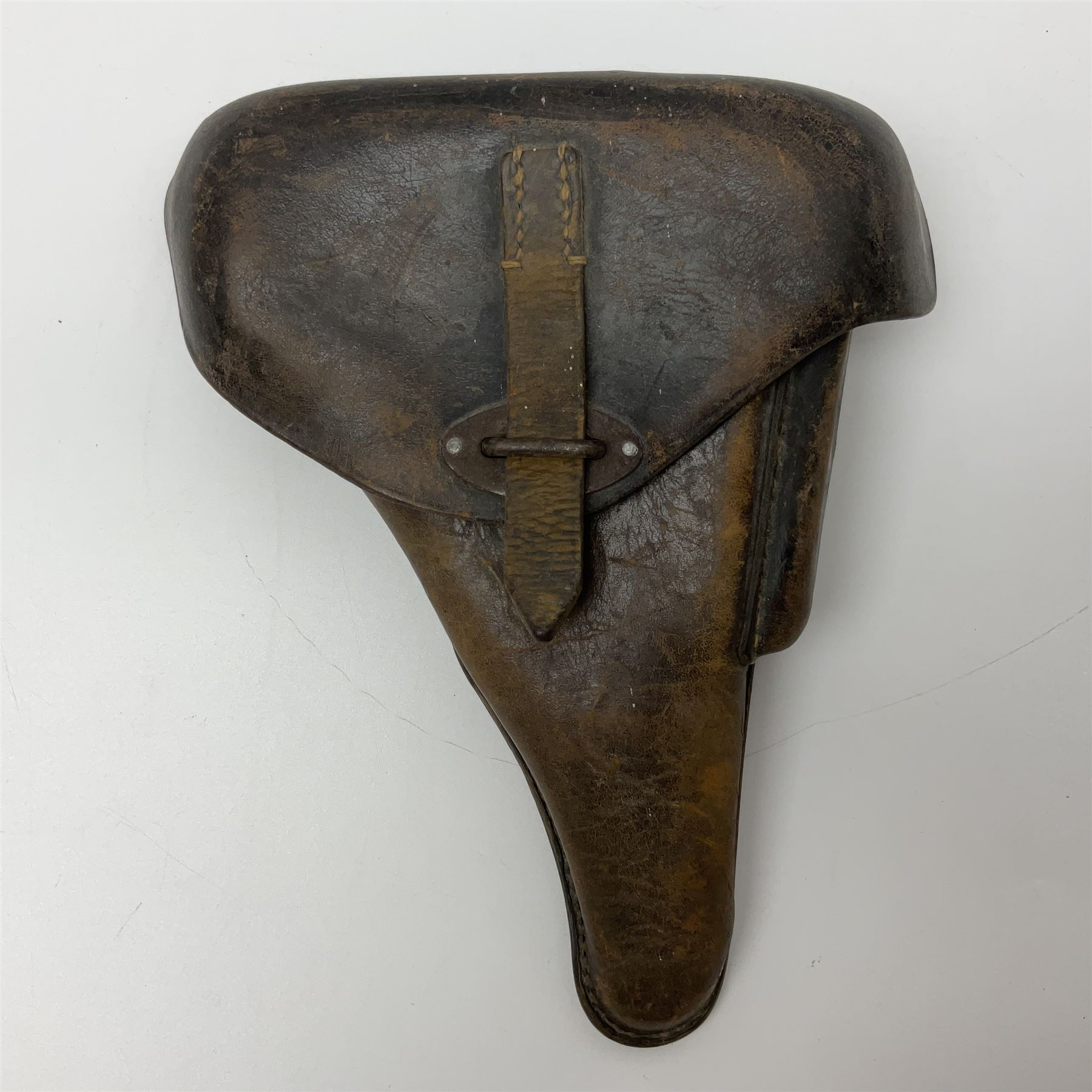 WWII German brown leather holster with side magazine pouch for a Walther P.38 semi-automatic pistol, stamped P38 and OWX 1941 on back L24.5cm