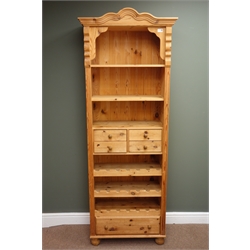  Solid pine open bookcase wine rack, arched projecting cresting rail,  two shelves above one long and four short drawers with three wine rack trays, bun feet, W73cm, H195cm, D36cm  