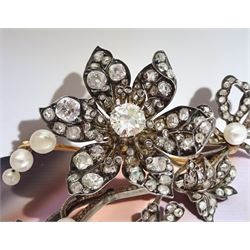 19th century gold and silver diamond and pearl en tremblant detachable brooch, the flower tremblant with a principal old cut diamond of approx 1.90 carat, the petals and stamen set with old cut and rose cut diamonds, total diamond weight approx 9.10 carat, to a foliate spray set set with further rose cut diamond and white / pink / cream pearls and ribbon tie