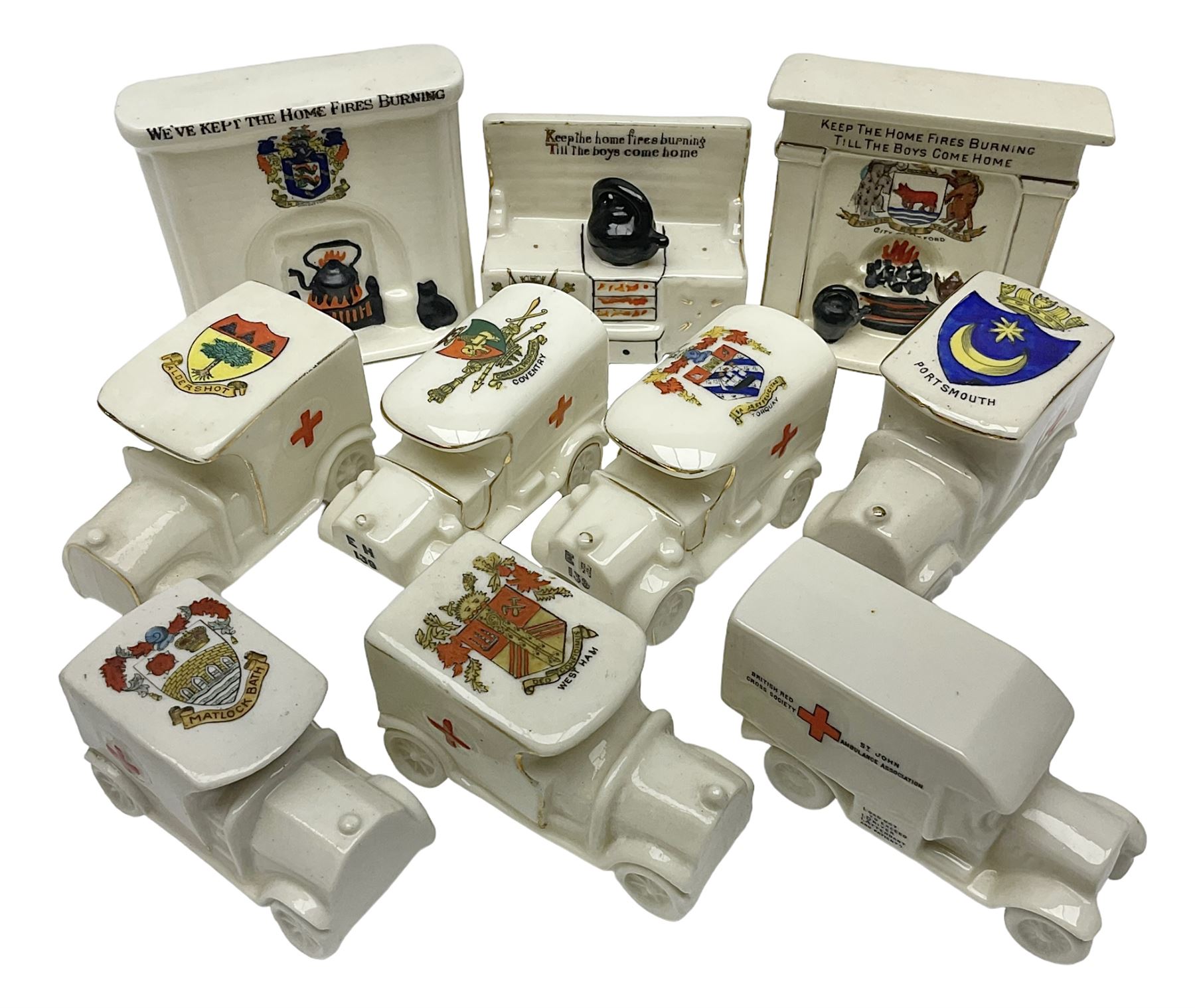 Ten WW1 crested china military models comprising seven field ambulances and three 'Home Fires Burning' fire-surrounds/range; various makers including Willow Art, Arcadian China, Grafton China, Savoy China, Carlton China etc; various crests including Devon, Aldershot, Portsmouth, West Ham, Coventry, Oxford, Hastings, Brighton etc (10)