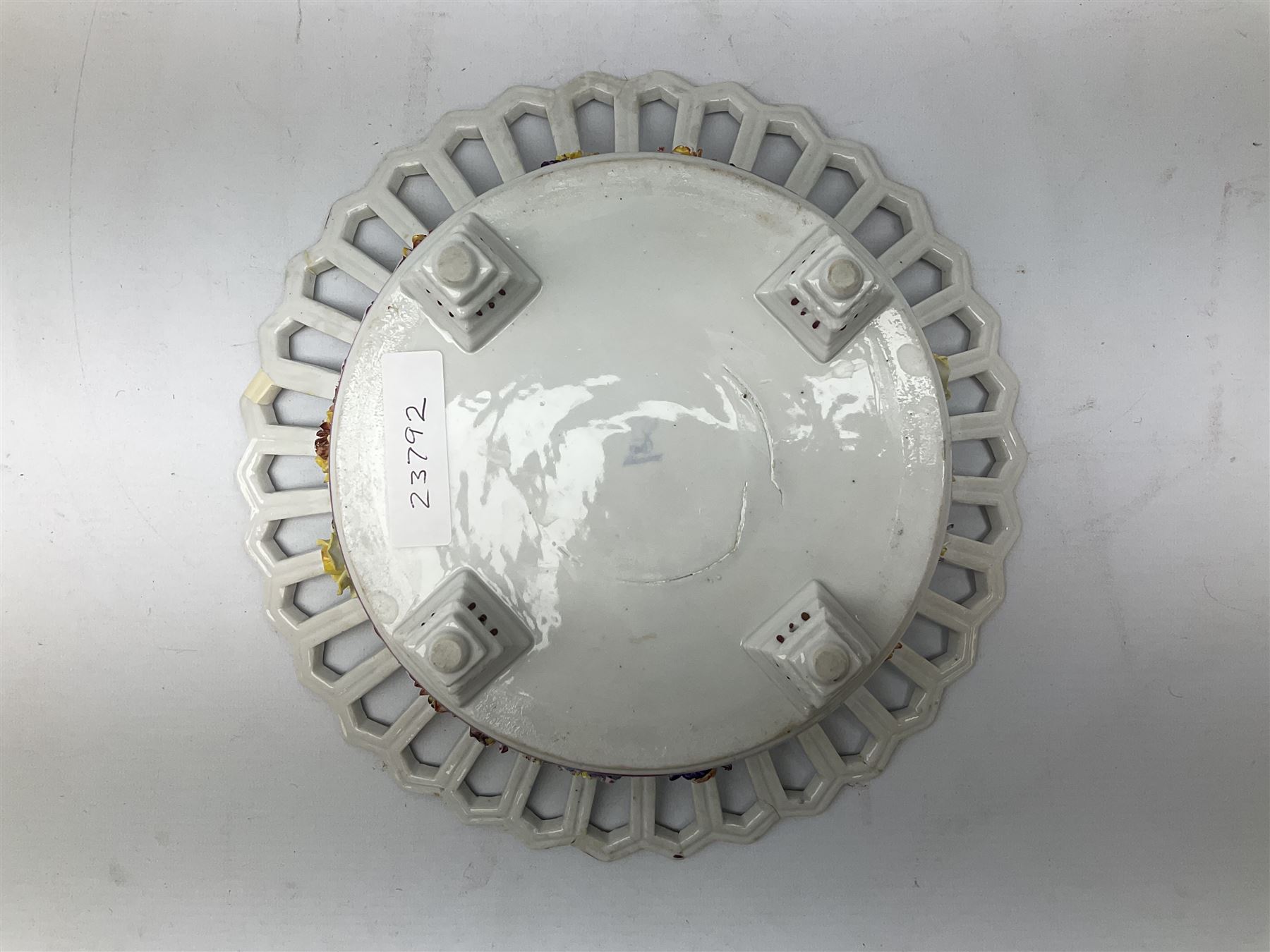 Early 20th century Dresden floral encrusted pierced bowl, centrally painted with flowers, on four tapering supports, D30cm 