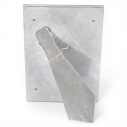 David Marshall photo frame, of cast aluminium mounted with a smaller brass frame, the maker's mark impressed to the lower left hand corner, H23cm