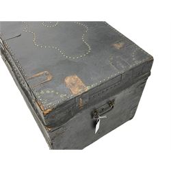 Late 19th/early 20th century traveling trunk, the hinged lid with decorative stud work, metal carrying handles