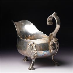 Late Victorian silver sauceboat with crimped rim, C scroll handle on shaped supports Sheffield 1899 Maker Martin Hall & Co, retailed by Allen & Daws, Norwich