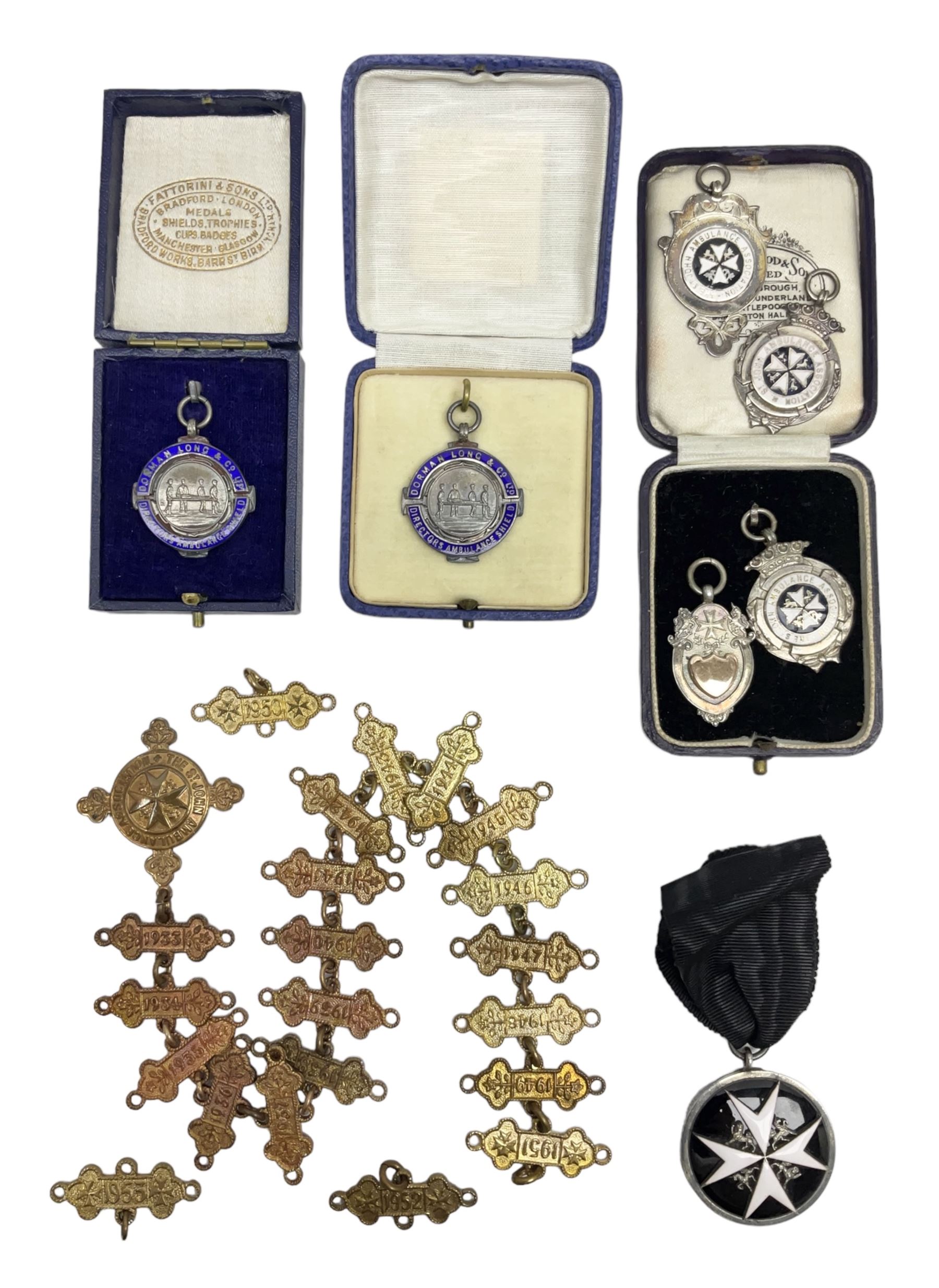 Four St John's silver fobs, together with two silver Directors Ambulance shield fobs and two other St Johns items 