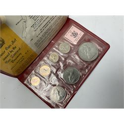 Quantity of Great British and World coins, including King George VI 1951 Festival of Britain crown coins in maroon or green card folders, two 1984 brilliant uncirculated coin collections in card folders, brass threepence pieces, sixpences, one shillings, two shillings, other pre-decimal coinage, Britain's first decimal coins sets in blue wallets, 1994 'Bank of England' two pound coin cover, Queen Elizabeth II United Kingdom and other commemorative crowns, pre Euro and other world coinage etc