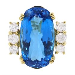18ct gold blue topaz and diamond ring, single oval cut blue topaz of approx 31.10 carat, w...