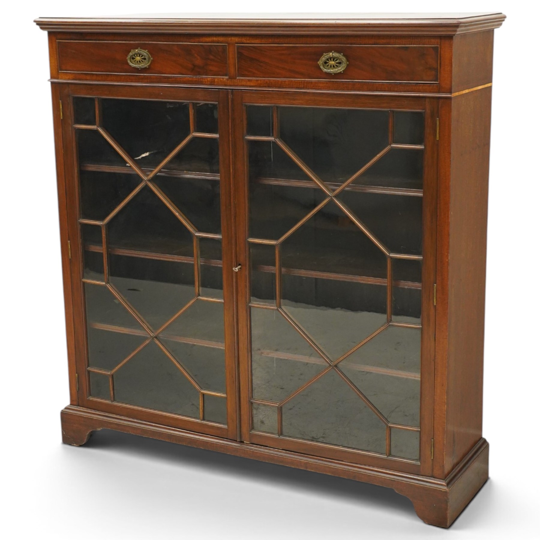 Late 19th century mahogany bookcase, fitted with two drawers over twin astragal glazed doors, enclosing three adjustable shelves, on bracket feet