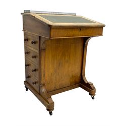 Early 19th century burr walnut Davenport desk, sloped leather-inset writing surface with brass gallery, fitted with an inkwell compartment and pen slot, four drawers to one side, raised on scrolled supports terminating in castors