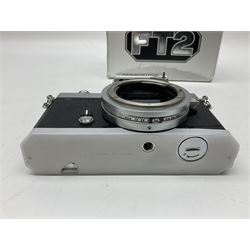 Nikkormat FT2 camera body, serial no. 5066813, in original packaging, together with Nikkormat EL camera body, serial no. 5577358, with Nikon Nikkor 50mm 1:1.8' lens no. 2143575, Nikkormat FT, serial no. 3968385, and Nikomat FT camera body, serial no. 4015491