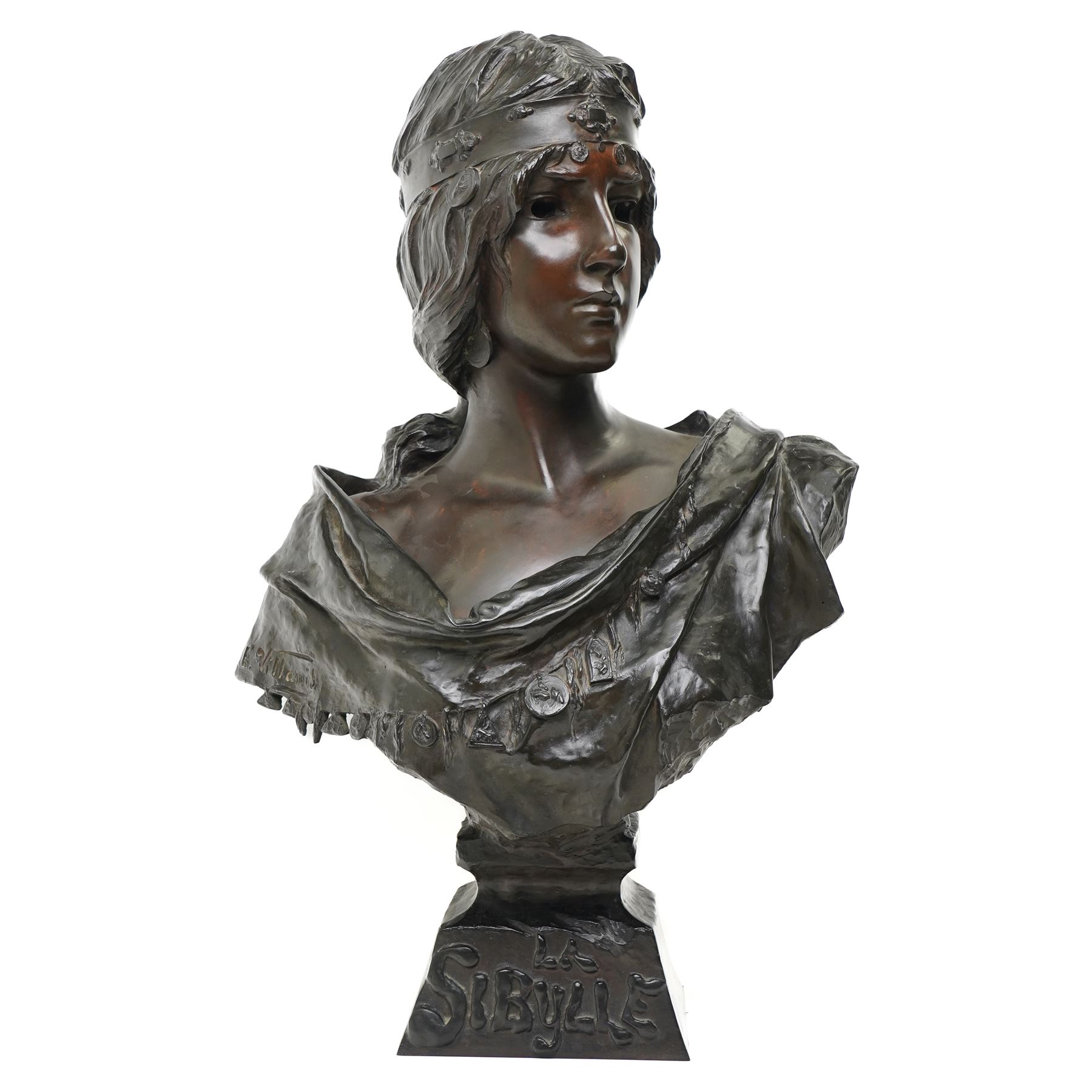 Emmanuele Villanis (French 1858-1914): Large Art Nouveau bronze bust 'La Sibylle' circa 1900, titled on the integral socle base and signed 'E.Villanis' in cast with 'Societe Des Bronzes De Paris' inset foundry mark and 'J.P 2888', H72cm
Notes: La Sibylle evokes the prophetic priestesses of classical antiquity, recalling the Cumaean Sibyl consulted by Aeneas in Virgil’s Aeneid