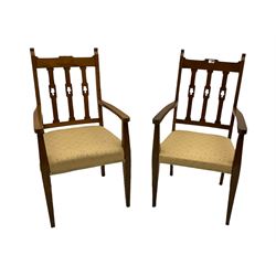 Pair early 20th century oak carver chairs, with triple shaped and pierced uprights, upholstered seats, on square tapering supports