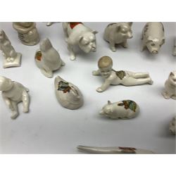 Collection of figural crested ware, to include Carlton Chins John Bull Alnwick, Clifton China Cheshire Cat,  Arcadia pig, Crafton crawling baby and another seated baby, quantity of cat, dog and pig figures, two Willow Art Model of Bunyans Statue, Toby jug, Victoria China, Arcadan bulldog, fish etc