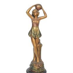 Four Art Deco style figures, modelled as dancers in various poses, finished in gilt and upon wooden plinths, H33cm