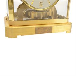 Jaeger-LeCoultre Atmos Clock - Caliber 528-6, 
gold-plated brass with glass panels, 15 jewel movement with atmospheric bellows winding motor, serial number 161881, circa 1960s, with engraved presentation plaque for W.W. Clayton, Canton Golf Club, 1964, in maker's box with instruction booklet, minute hand detached, H23.5xW21xD16cm