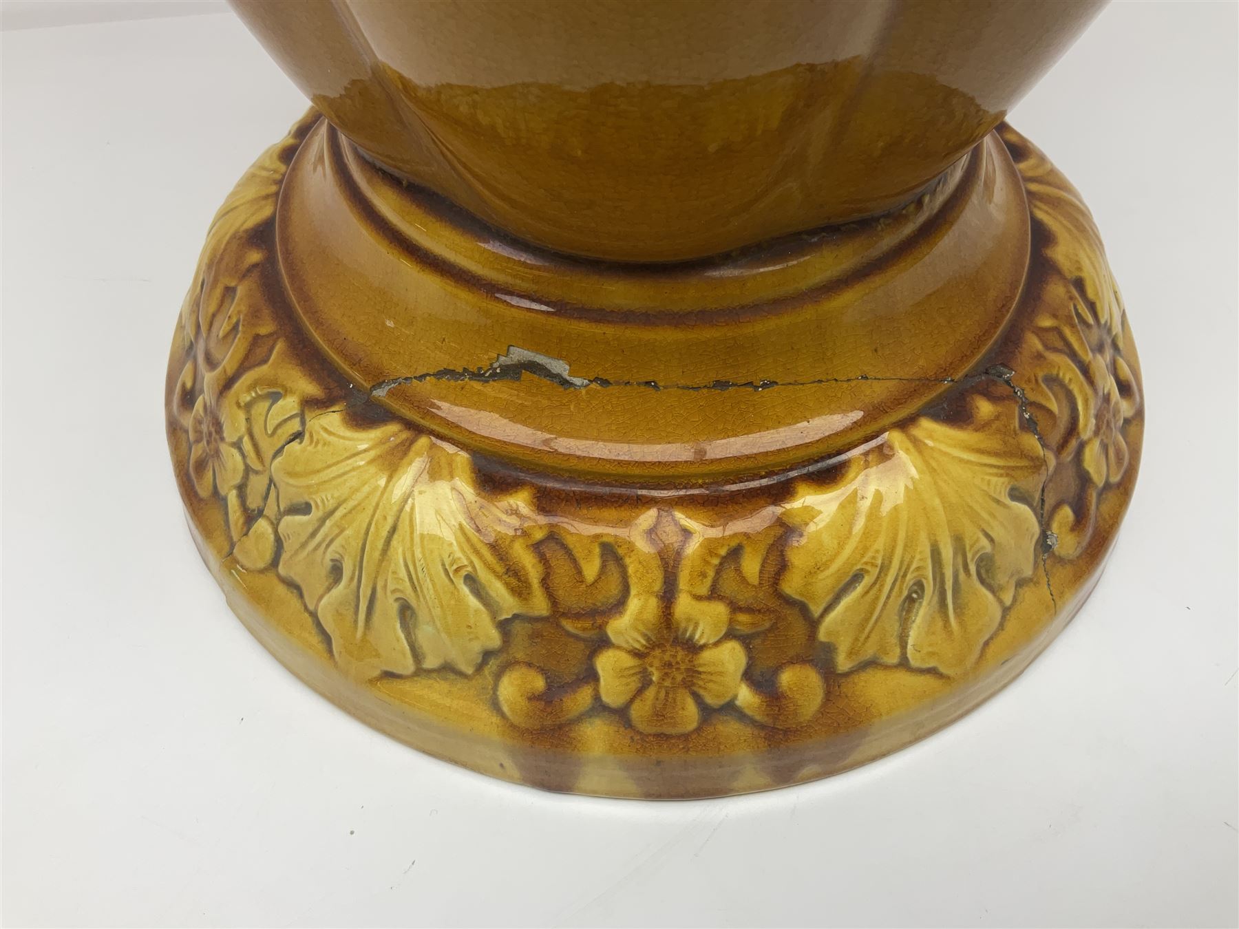 Bretby Jardiniere and stand, with foliate and foliage decoration with a red and yellow ground, impressed mark beneath H94cm