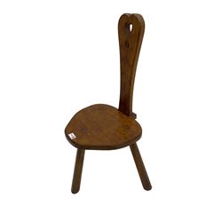 Acornman - adzed oak spinning chair, spoon shaped back with pierced heart and acorn signature, spade-shaped seat raised on octagonal tapering supports by Alan Grainger of Brandsby