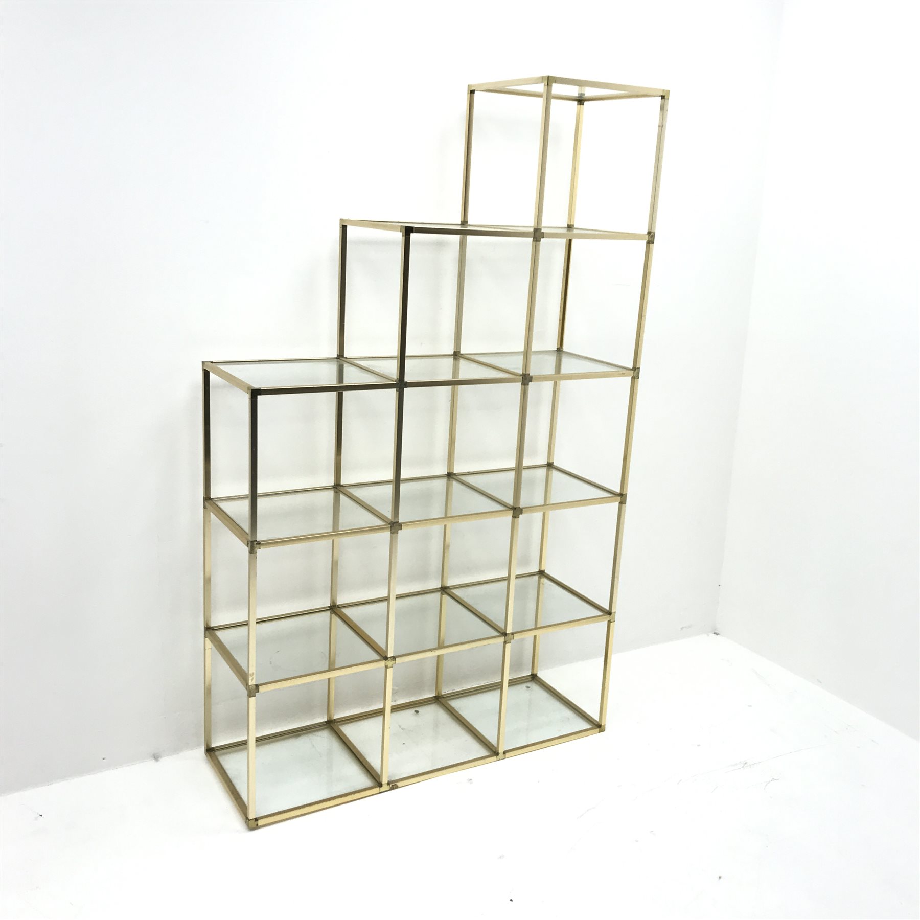 Mid Century staggered metal framed display stand with glass shelving